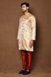 Aryavir Malhotra_Beige Sherwani Raw Silk Floral Blooming Pattern With Churidar _at_Aza_Fashions