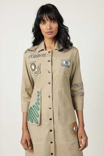 Shahin Mannan_Beige Poplin Embroidery Collared Abstract Shapes Pocket Dress _at_Aza_Fashions