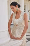 Charu and Vasundhara_Ivory Bustier Silk Embroidery Thread V Neck Surraya Leaf Jacket And Skirt Set_Online_at_Aza_Fashions