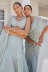 Charu and Vasundhara_Blue Net Embroidery Sequin Leaf Neck Stasia Diamond Pattern Bridal Lehenga Set_at_Aza_Fashions