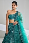 Shop_Seema Gujral_Green Net Embroidered Sequins One Shoulder Bridal Lehenga Set  _Online_at_Aza_Fashions