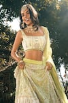 The House of Exotique_Ivory Net Embroidered Crystal Scoop Embellished Bridal Lehenga Set  _Online_at_Aza_Fashions