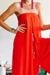 Style Junkiie_Red Double Georgette Tassel Ornamentation Asymmetric Hem Jumpsuit  _at_Aza_Fashions