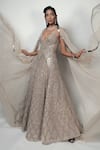 Rohit Gandhi + Rahul Khanna Beige Tulle Crystals V-neck Spatial Metallic Gown With Cape Online at Aza Fashions Rohit Gandhi + Rahul Khanna_Beige Tulle Crystals V-neck Spatial Metallic Gown With Cape _Online_at_Aza_Fashions