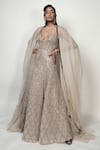 Shop Rohit Gandhi + Rahul Khanna Beige Tulle Crystals V-neck Spatial Metallic Gown With Cape Online at Aza Fashions Shop_Rohit Gandhi + Rahul Khanna_Beige Tulle Crystals V-neck Spatial Metallic Gown With Cape _Online_at_Aza_Fashions