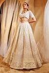 House of Exotique_Ivory Net Embroidery Round Neck Geometric Embellished Lehenga Set _Online_at_Aza_Fashions