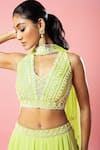 Buy_Quench A Thirst_Green Georgette Hand Embroidery Cutdana V Neck Pleated Lehenga And Blouse Set _Online_at_Aza_Fashions