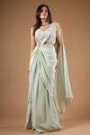 Vana Ethnics_Green Viscose Sequins, Embroidery V-neck Pre-draped Saree With Blouse _at_Aza_Fashions