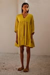 Shop_Kharakapas_Yellow Mul Cotton V Neck Marigold Tiered Dress  _Online_at_Aza_Fashions