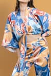 Mandira Wirk Resort_Blue Satin Hawaii Print V Neck Wrap Top And Bell Bottom Set_at_Aza_Fashions