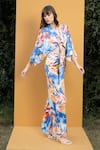 Shop_Mandira Wirk Resort_Blue Satin Hawaii Print V Neck Wrap Top And Bell Bottom Set_Online_at_Aza_Fashions