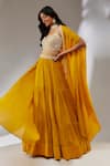 Buy_Neha Khullar_Yellow Chiffon Embroidery Cutdana Cape Open Tiered Lehenga Set _Online_at_Aza_Fashions