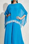 Shop_NAMRATA JOSHIPURA_Blue Georgette Hand Embellished Floral Patterns Round Wisteria Cape Jumpsuit_Online_at_Aza_Fashions