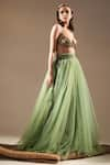 Buy_Nikita Mhaisalkar_Green Tulle Solid Flared Lehenga _Online_at_Aza_Fashions