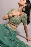RIA SHAH LABEL_Green Organza Embroidered Floral Sweetheart Neck Lehenga Set _at_Aza_Fashions
