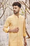 Shop_Charkhee_Off White Dobby Cotton Solid Short Kurta For Men_Online_at_Aza_Fashions