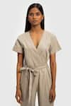 Shop_Reistor_Beige Poplin V Neck Solid Front Tie-up Jumpsuit  _Online_at_Aza_Fashions