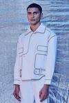Shop_Line Out Line_Off White Cotton Embroidered Patch Work And Piping Asymmetric Bomber Jacket_Online_at_Aza_Fashions