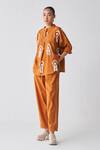 Three_Orange Handloom Cotton Fringe Round Abstract Embroidered Bat Wing Sleeve Top_Online_at_Aza_Fashions