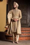 Nitika Gujral_Gold Achkan: Raw Silk Embroidered Dori Antique Set For Men_Online_at_Aza_Fashions