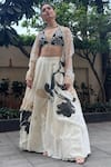 Buy_Devnaagri_Ivory Chanderi Hand Painted Floral Plunge V Neck Lehenga Set _at_Aza_Fashions