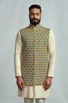 Buy Arjuun Kilachand Yellow Suiting Embroidered Bundi And Kurta Set at Aza Fashions Buy_Arjuun Kilachand_Yellow Suiting Embroidered Bundi And Kurta Set _at_Aza_Fashions