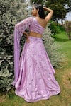 Shop Amit GT Purple One Shoulder Draped Blouse And Layered Lehenga Set at Aza Fashions Shop_Amit GT_Purple One Shoulder Draped Blouse And Layered Lehenga Set _at_Aza_Fashions