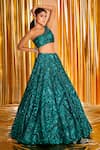 Seema Gujral_Green Net Embroidered Sequins One Shoulder Bridal Lehenga Set  _Online_at_Aza_Fashions