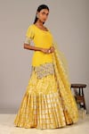 Nidhika Shekhar_Yellow Crepe U Neck Embellished Kurta Lehenga Set _Online_at_Aza_Fashions