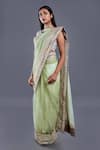 Divya Kanakia_Green Net Sequins V Neck Saree With Blouse _Online_at_Aza_Fashions