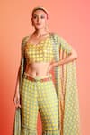 Shop Diyarajvvir Yellow Georgette, Modal V Neck Printed Cape And Sharara Set at Aza Fashions Shop_Diyarajvvir_Yellow Georgette, Modal V Neck Printed Cape And Sharara Set _at_Aza_Fashions