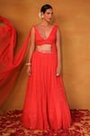 Buy_Esha Koul_Peach Net Embroidery V Neck Embellished Draped Blouse And Lehenga _at_Aza_Fashions