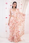 Buy_Esha Koul_Pink Georgette Printed Floral Motifs Scoop Neck Ruffle Saree With Blouse _at_Aza_Fashions