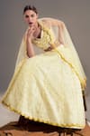Shloka Sudhakar_Yellow Organza, Net, Suede Floral V Neck Embroidered Lehenga Set _Online_at_Aza_Fashions