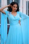 House of Tushaom_Blue Georgette Embroidery Sequin Leaf Neck Cape Sleeve Draped Gown _at_Aza_Fashions