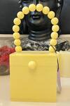 Shop_Handle Those Bags_Yellow Cubical Marble Textured Bag_at_Aza_Fashions