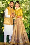 Buy_Rajdeep Ranawat_Yellow Dupion Asymmetric Tunic And Bandhani Print Lehenga Set_at_Aza_Fashions