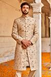 Shop_Jayanti Reddy_Beige , Raw Zardozi Floral Embroidered Sherwani Set _at_Aza_Fashions