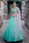 Buy_Keerthi Kadire_Green Raw Silk, Crepe Scoop Neck Blouse And Lehenga Set _at_Aza_Fashions