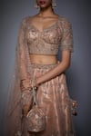 RI.Ritu Kumar_Pink Net V-shaped Neckline Embroidered Bridal Lehenga Set _at_Aza_Fashions