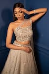 Buy_PARUL GANDHI_Peach Jacquard Shimmer Organza Embroidery Asymmetric Lehenga Set _Online_at_Aza_Fashions