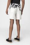 Shop Genes Lecoanet Hemant White Stretch H. Bone Bamboo Leaves Leaf Print Shorts at Aza Fashions Shop_Genes Lecoanet Hemant_White Stretch H. Bone Bamboo Leaves Leaf Print Shorts_at_Aza_Fashions