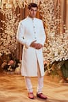 Buy_Bindani by Jigar & Nikita_White Textured Sherwani And Churidar Set_at_Aza_Fashions