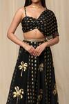 Shop_Masaba_Black Crepe Printed Wallflower Asymmetric Draped Bustier And Lehenga Set _Online_at_Aza_Fashions