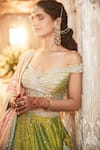 Shop Matsya Green Silk Dori, Zardozi And Mirror Work One The Iconic Winged Temple Lehenga Set at Aza Fashions Shop_Matsya_Green Silk Dori, Zardozi And Mirror Work One The Iconic Winged Temple Lehenga Set _at_Aza_Fashions