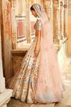 Shop Matsya Ivory Silk Dori, Swarovski, The Pichwai Bagh Embroidered Bridal Lehenga Set at Aza Fashions Shop_Matsya_Ivory Silk Dori, Swarovski, The Pichwai Bagh Embroidered Bridal Lehenga Set _at_Aza_Fashions