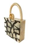 Shop_Oceana Clutches_Black Zebra Textured Handbag With U-shaped Handle_Online_at_Aza_Fashions