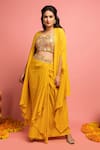 Buy_Nitara Dhanraj Label_Yellow Raw Silk Embroidered Mirror Work Sweetheart Neck Cape Lehenga Set _Online_at_Aza_Fashions