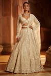 Buy_Nitika Gujral_Cream Tulle Embroidered Floral Sweetheart Neck Bridal Lehenga Set _at_Aza_Fashions