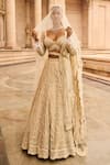 Buy_Nitika Gujral_Cream Tulle Embroidered Floral Sweetheart Neck Bridal Lehenga Set _Online_at_Aza_Fashions